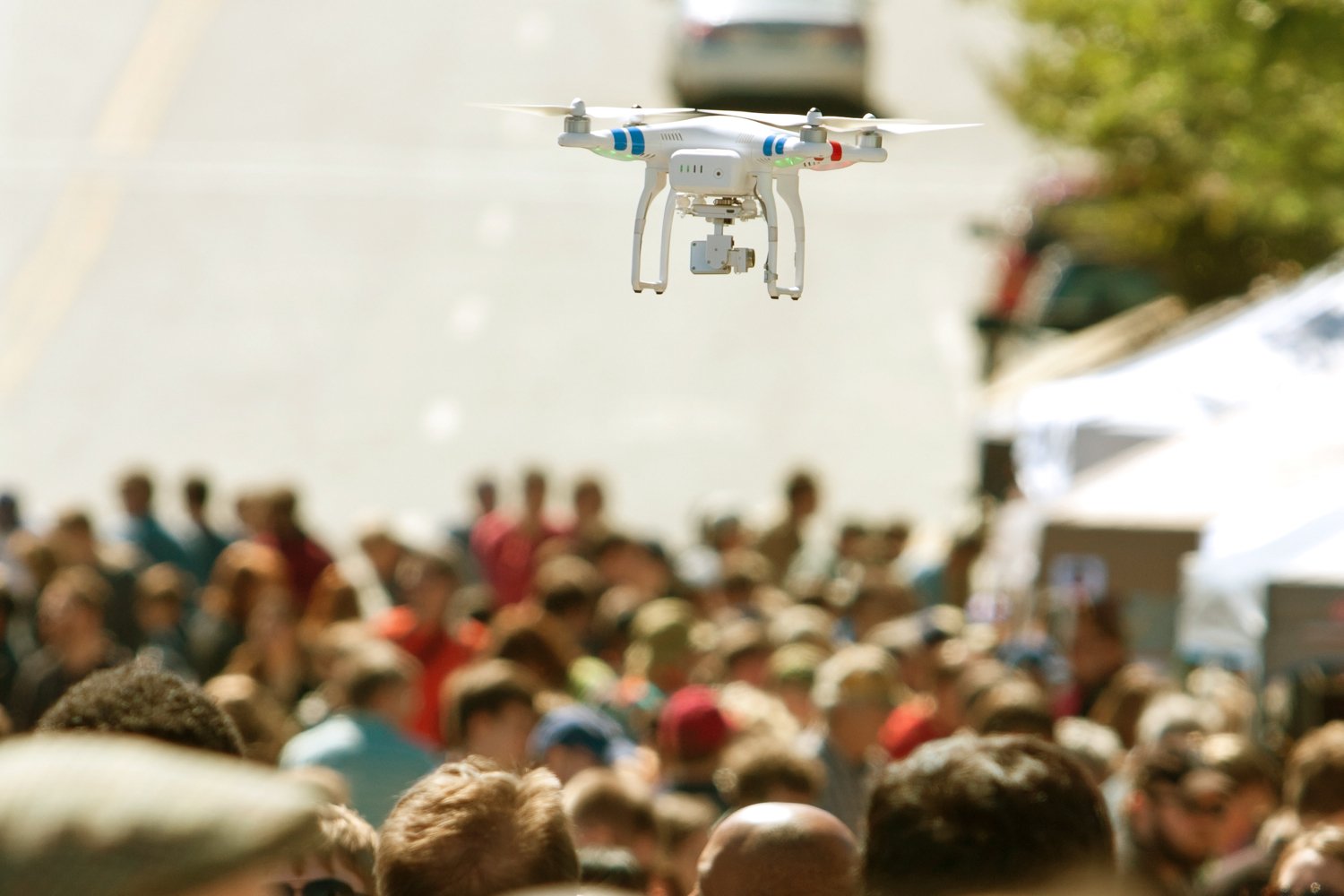 fly a drone directly over a crowd